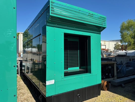 Cummins DQDAA 250kW diesel generator exterior view with green weather enclosure and 24-hour subbase fuel tank.